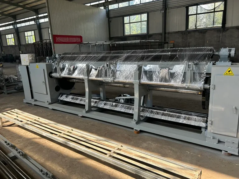 CNC hexagonal wire mesh machine fully wrapped in protective film and packaged, awaiting container loading for shipment