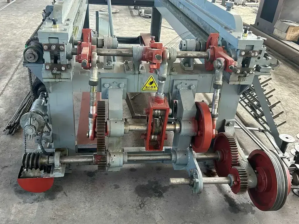 Small hexagonal wire mesh machine core gear drive system close-up