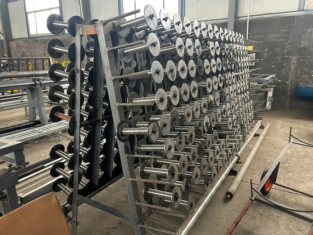 Wire reel stand for automatic hexagonal wire mesh machine, fully loaded with wire bobbins for smooth and consistent wire feeding during production