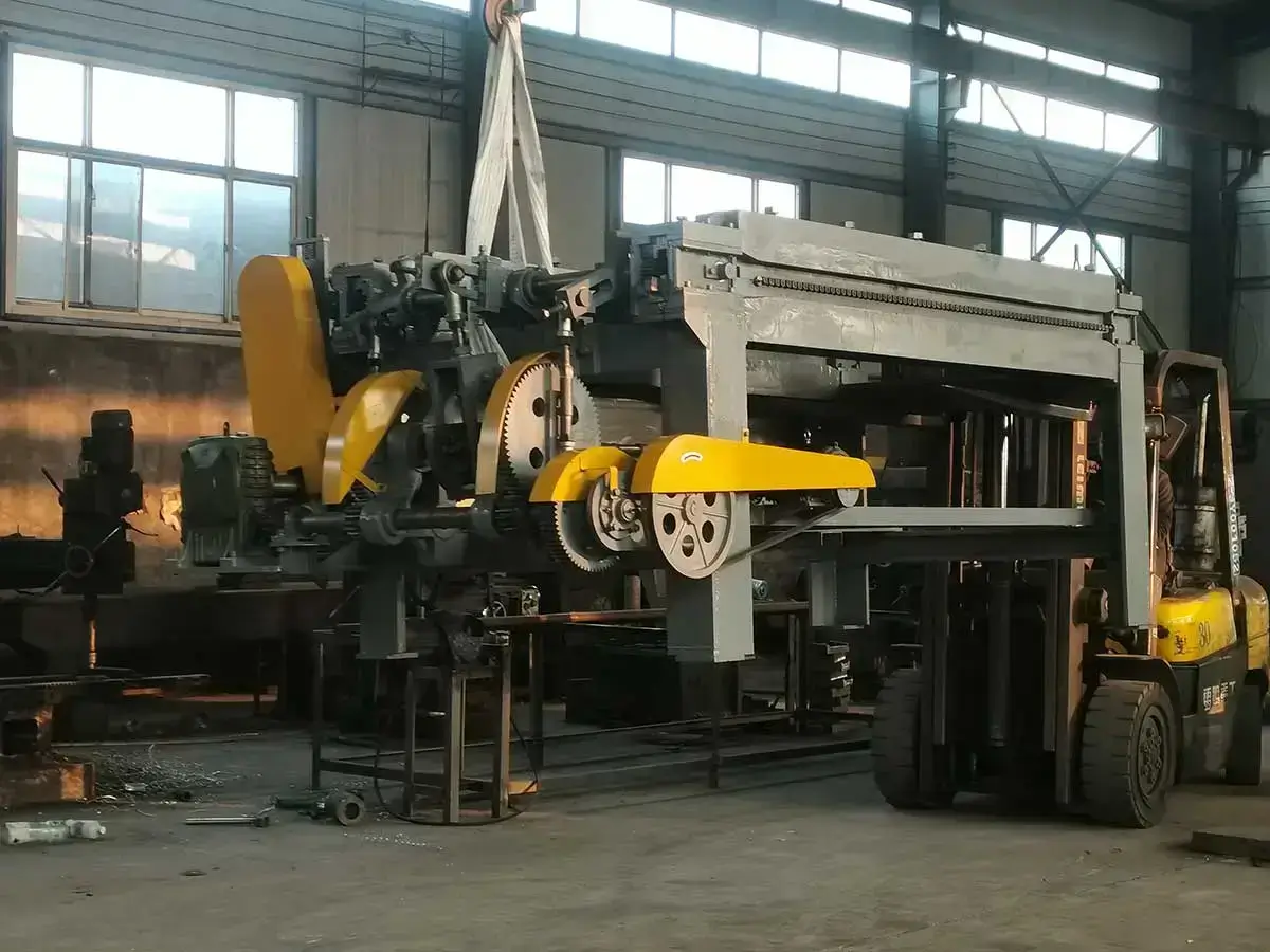 Factory workers operating forklifts to load and transport polyester hexagonal wire mesh machines within the facility